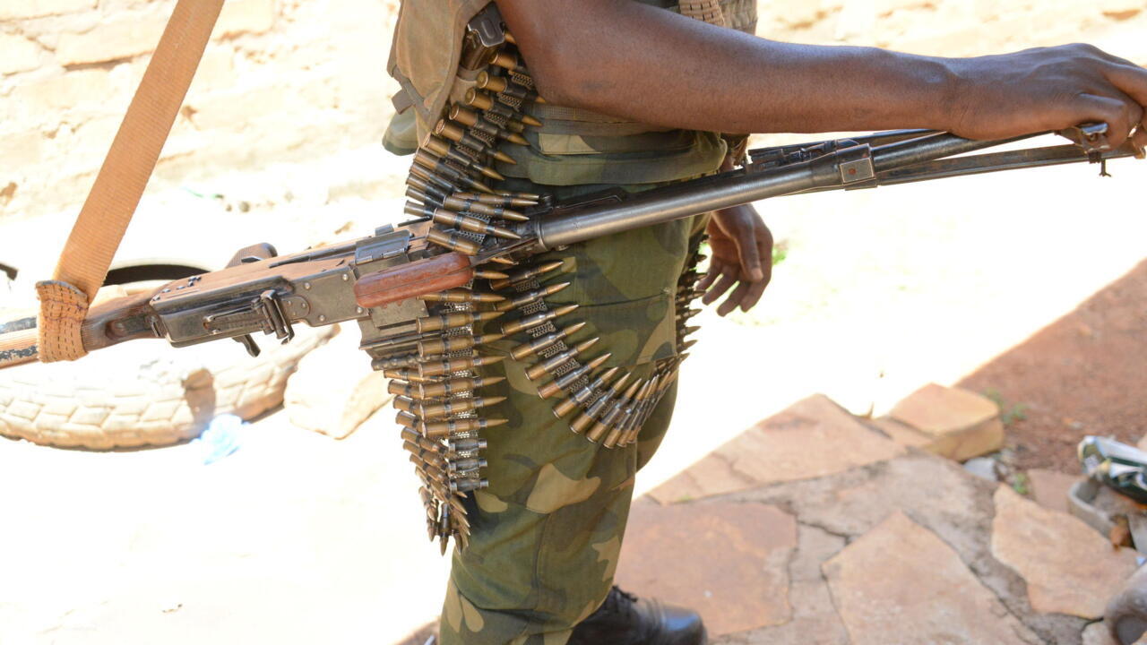 A member of Seleka fighters poses with his weapons on May 15, 2015 near Bambari. AFP PHOTO / PACOME PABANDJI